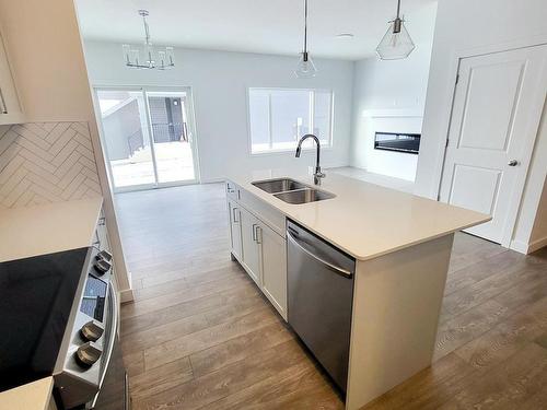 140 Rancher Road, Ardrossan, AB - Indoor Photo Showing Kitchen With Double Sink With Upgraded Kitchen