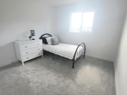 140 Rancher Road, Ardrossan, AB - Indoor Photo Showing Bedroom