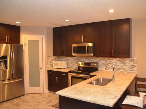 16715 60 Street, Edmonton, AB - Indoor Photo Showing Kitchen With Stainless Steel Kitchen With Double Sink