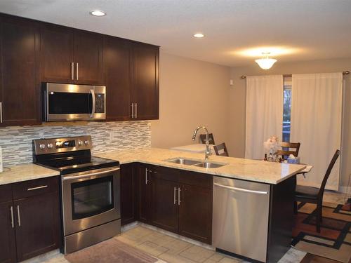 16715 60 Street, Edmonton, AB - Indoor Photo Showing Kitchen With Stainless Steel Kitchen With Double Sink With Upgraded Kitchen