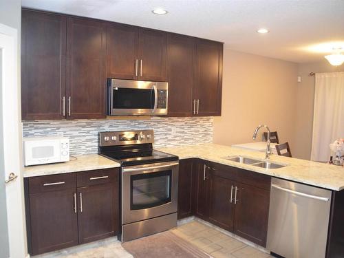 16715 60 Street, Edmonton, AB - Indoor Photo Showing Kitchen With Stainless Steel Kitchen With Double Sink With Upgraded Kitchen