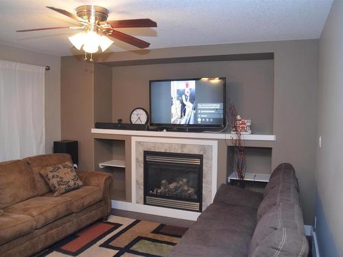 16715 60 Street, Edmonton, AB - Indoor Photo Showing Living Room With Fireplace