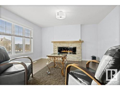 3707 48 Avenue, Beaumont, AB - Indoor Photo Showing Living Room With Fireplace