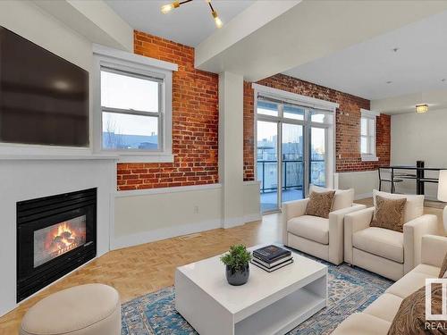 406 10728 82 Avenue, Edmonton, AB - Indoor Photo Showing Living Room With Fireplace