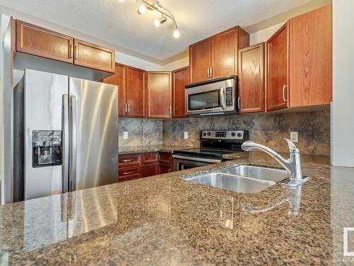 128 5420 Grant Macewan Blvd, Leduc, AB - Indoor Photo Showing Kitchen With Double Sink