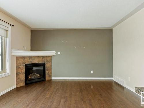 128 5420 Grant Macewan Blvd, Leduc, AB - Indoor With Fireplace