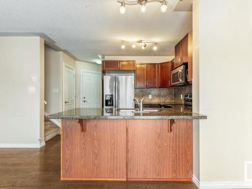 128 5420 Grant Macewan Blvd, Leduc, AB - Indoor Photo Showing Kitchen