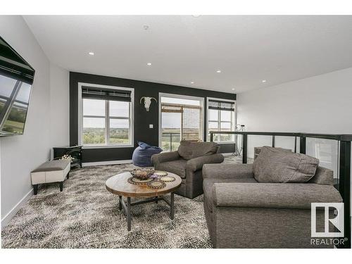 404 9940 Sherridon Drive, Fort Saskatchewan, AB - Indoor Photo Showing Living Room