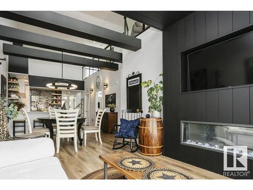 404 9940 Sherridon Drive, Fort Saskatchewan, AB - Indoor Photo Showing Living Room With Fireplace