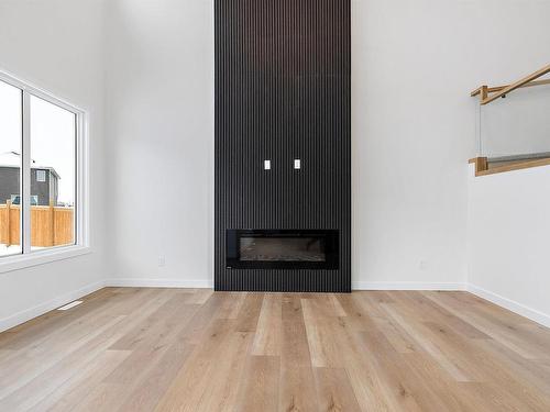 9 Sturtz Hollow, Leduc, AB - Indoor Photo Showing Living Room With Fireplace