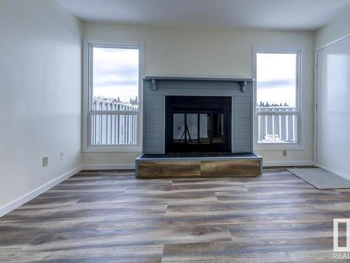 14 4610 17 Avenue, Edmonton, AB - Indoor Photo Showing Living Room With Fireplace