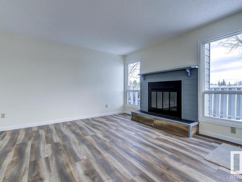 14 4610 17 Avenue, Edmonton, AB - Indoor Photo Showing Living Room With Fireplace