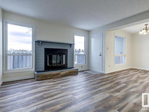 14 4610 17 Avenue, Edmonton, AB - Indoor Photo Showing Living Room With Fireplace