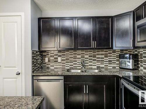 35 3305 Orchards Link Link, Edmonton, AB - Indoor Photo Showing Kitchen With Double Sink With Upgraded Kitchen