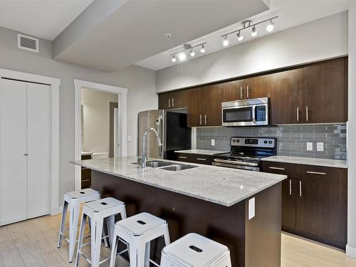 905 10226 104 Street, Edmonton, AB - Indoor Photo Showing Kitchen With Stainless Steel Kitchen With Double Sink