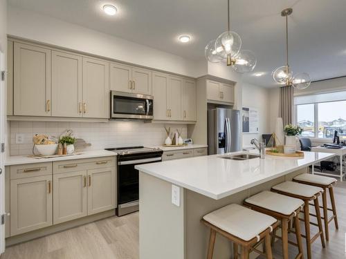 728 Southfork Drive, Leduc, AB - Indoor Photo Showing Kitchen With Double Sink With Upgraded Kitchen