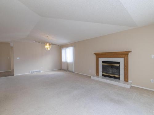 78 Highwood Bay, Devon, AB - Indoor Photo Showing Living Room With Fireplace