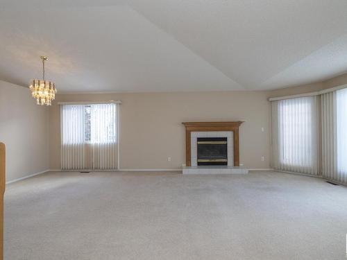 78 Highwood Bay, Devon, AB - Indoor Photo Showing Living Room With Fireplace