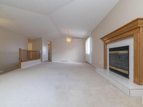 78 Highwood Bay, Devon, AB - Indoor With Fireplace