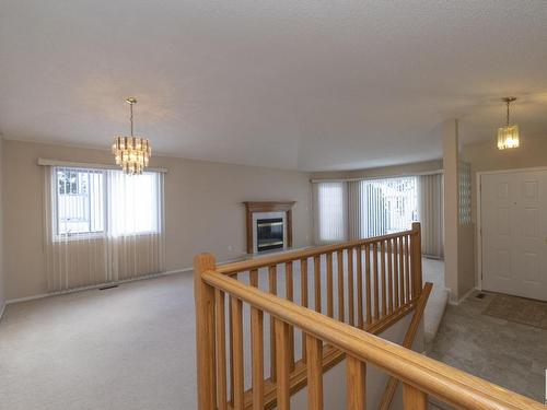 78 Highwood Bay, Devon, AB - Indoor Photo Showing Other Room With Fireplace