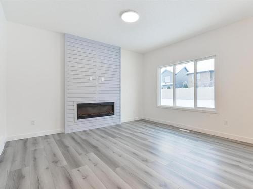 31 Penn Place, Spruce Grove, AB - Indoor Photo Showing Living Room With Fireplace