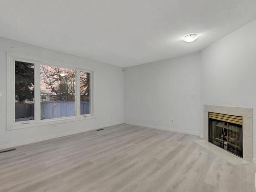 15 14717 34 Street Nw, Edmonton, AB - Indoor Photo Showing Other Room With Fireplace