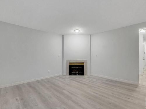 15 14717 34 Street Nw, Edmonton, AB - Indoor Photo Showing Other Room With Fireplace