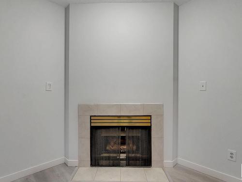 15 14717 34 Street Nw, Edmonton, AB - Indoor Photo Showing Living Room With Fireplace