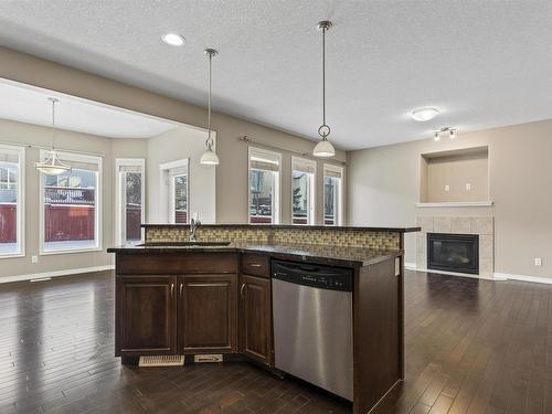 6111 11 Avenue, Edmonton, AB - Indoor Photo Showing Kitchen With Fireplace