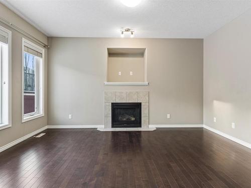 6111 11 Avenue, Edmonton, AB - Indoor Photo Showing Living Room With Fireplace