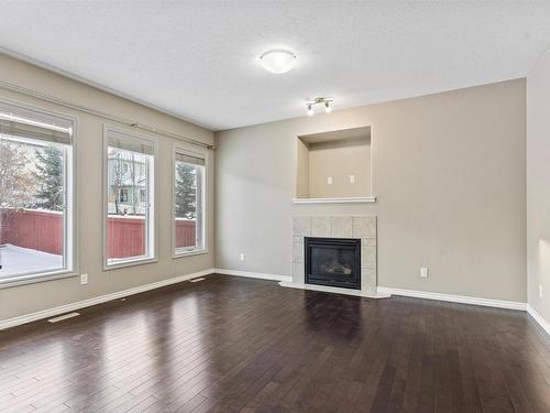 6111 11 Avenue, Edmonton, AB - Indoor Photo Showing Living Room With Fireplace