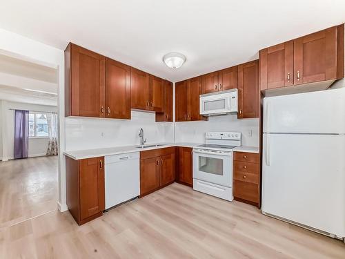 14625 55 Street, Edmonton, AB - Indoor Photo Showing Kitchen With Double Sink