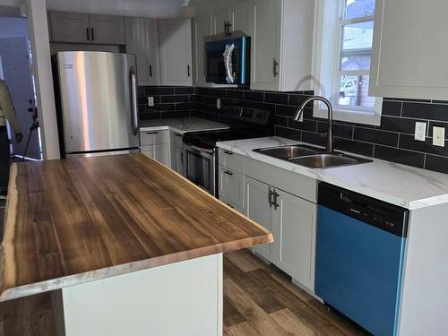 Edmonton, AB - Indoor Photo Showing Kitchen With Double Sink