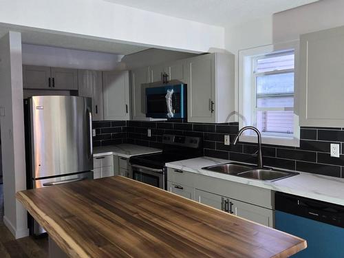 Edmonton, AB - Indoor Photo Showing Kitchen With Double Sink