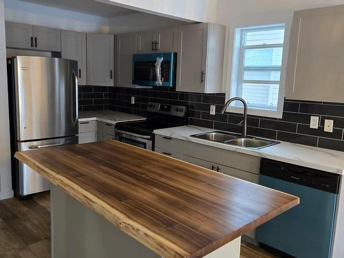 Edmonton, AB - Indoor Photo Showing Kitchen With Double Sink