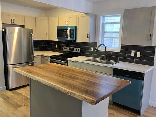 Edmonton, AB - Indoor Photo Showing Kitchen With Double Sink