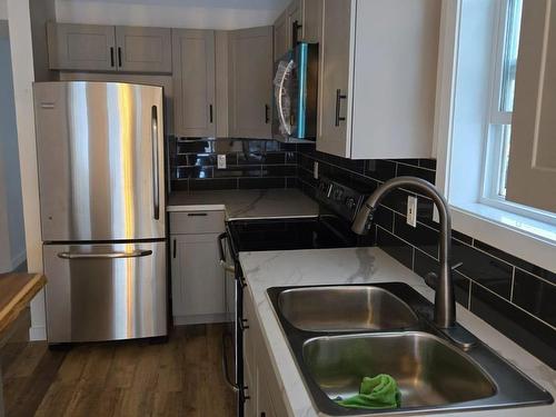 Edmonton, AB - Indoor Photo Showing Kitchen With Double Sink