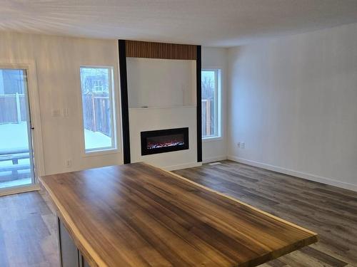 Edmonton, AB - Indoor Photo Showing Living Room With Fireplace