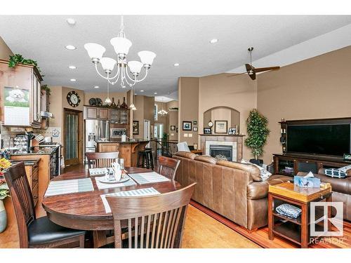 81 Walters Place, Leduc, AB - Indoor Photo Showing Dining Room With Fireplace