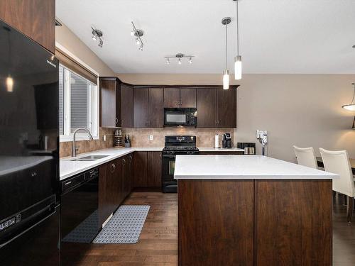 7323 21 Avenue, Edmonton, AB - Indoor Photo Showing Kitchen With Double Sink