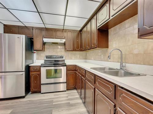 6807 12 Avenue, Edmonton, AB - Indoor Photo Showing Kitchen With Double Sink