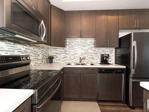 8 4850 Terwillegar Common, Edmonton, AB - Indoor Photo Showing Kitchen With Stainless Steel Kitchen With Double Sink