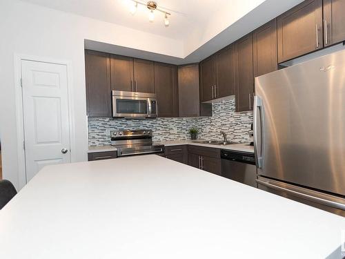 8 4850 Terwillegar Common, Edmonton, AB - Indoor Photo Showing Kitchen With Stainless Steel Kitchen With Double Sink With Upgraded Kitchen