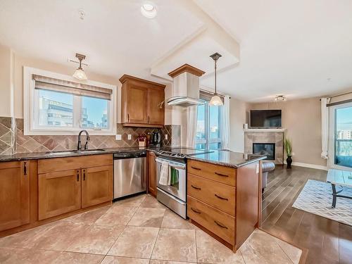 510 10142 111 Street, Edmonton, AB - Indoor Photo Showing Kitchen With Fireplace With Stainless Steel Kitchen