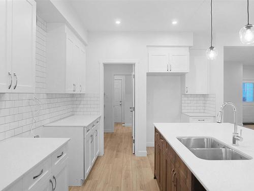 4934 Kinney Road, Edmonton, AB - Indoor Photo Showing Kitchen With Double Sink