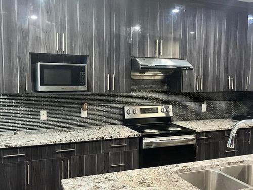 2518 22 Avenue, Edmonton, AB - Indoor Photo Showing Kitchen With Double Sink With Upgraded Kitchen