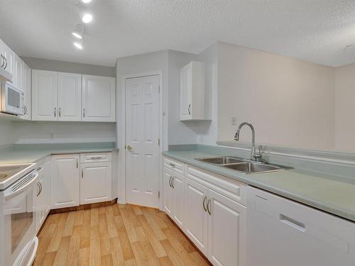 204 5106 49 Avenue, Leduc, AB - Indoor Photo Showing Kitchen With Double Sink