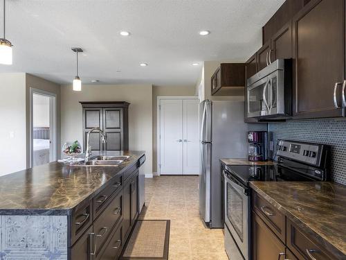 302 5025 Edgemont Boulevard Nw, Edmonton, AB - Indoor Photo Showing Kitchen With Double Sink