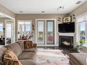 458 6079 Maynard Way, Edmonton, AB  - Indoor Photo Showing Living Room With Fireplace 