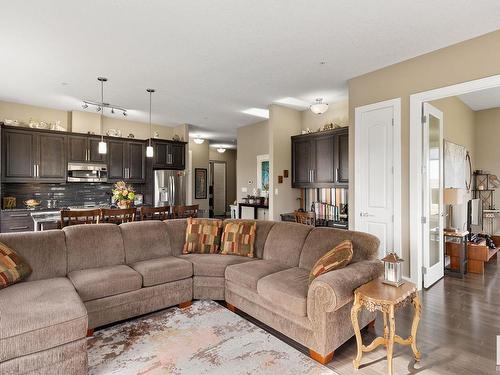 458 6079 Maynard Way, Edmonton, AB - Indoor Photo Showing Living Room